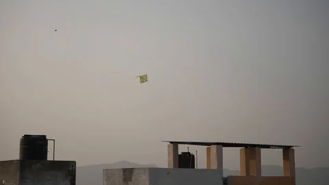 PUSHKAR, India -  a kite flutters above the rooftops of Pushkar town 스톡 동영상 87353595
