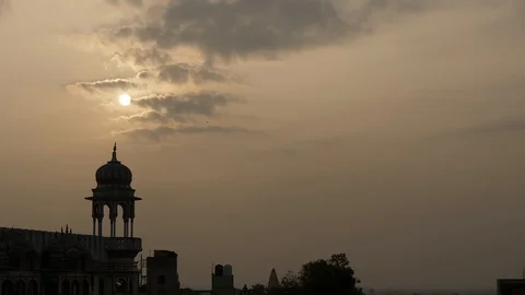 PUSHKAR, India - old building and kites silhouetted against early evening sky Stock Footage 87352143