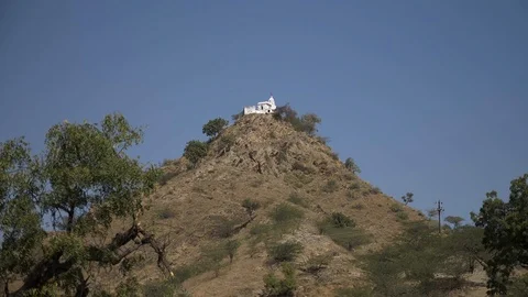 PUSHKAR, India - The Pap Mochani Temple on rocky hill outside Pushkar town Stock-Footage 87355611