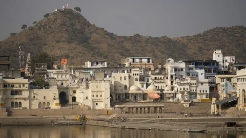 PUSHKAR, India - Pushkar Lake Ghats, town buildings and the Pap Mochani Temple Video stock 87330835