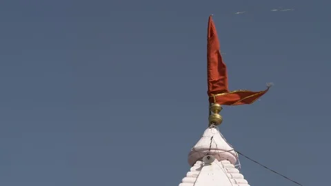 PUSHKAR, India - red flag moves in breeze on The Pap Mochani Temple Stock-Footage 87357996