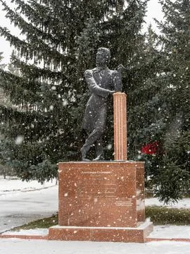 Pushkin Statue During Snowfall in Karakol Park Stock Photos