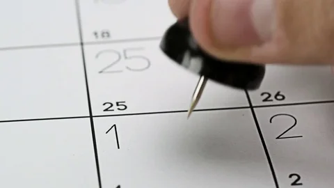 Pushpin on calendar Stock Footage 83553918