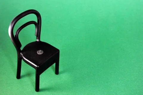Pushpin on the chair Stock Photos