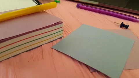 Pushpin, hand, notebook color paper Stock Footage 88047909