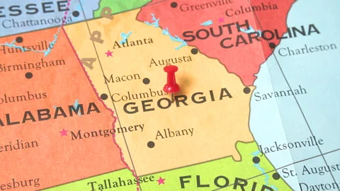 A pushpin on the map of Georgia that starts with a blur Stock Footage 168656749