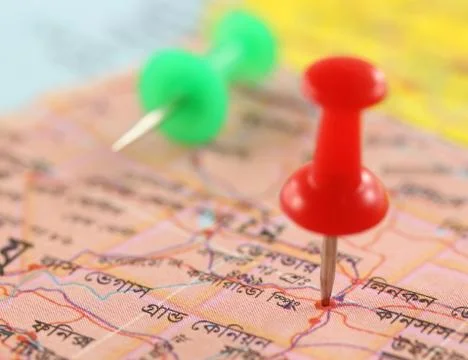 Pushpin pointing place on map Stock Photos