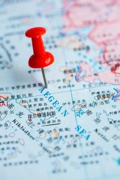 Pushpin stuck in the map Stock Photos