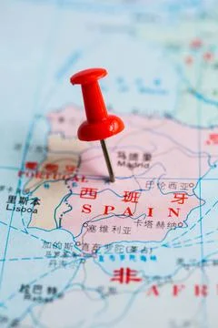 Pushpin stuck in the map Stock Photos