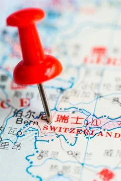 Pushpin stuck in the map Stock Photos