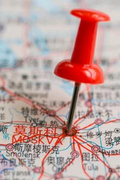 Pushpin stuck in the map Stock Photos