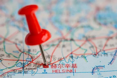 Pushpin stuck in the map Stock Photos