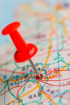 Pushpin stuck in the map Stock Photos
