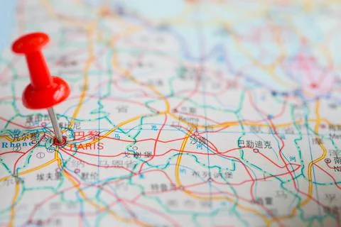 Pushpin stuck in the map Stock Photos