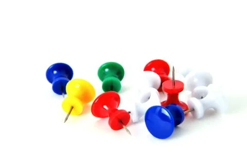 Pushpins on a white background macro Stock Photos