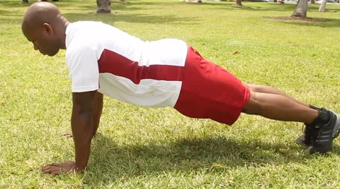 Pushups in the park - slow motion Stock Footage 955050