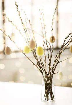 Pussy willow branches decorated by easter eggs Stock Photos