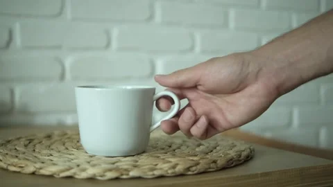 Put and take a white cup of green tea on a wooden table. Healthy Chinese tea, ri Stock Footage 161326712
