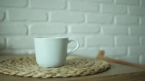 Put and take a white cup of green tea on a wooden table. Healthy Chinese tea, ri Stock Footage 161327215
