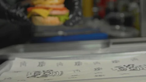 Put an appetizing burger on the table. Stock Footage 102510729