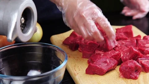 Put beef to meat grinder Stock Footage 73805316