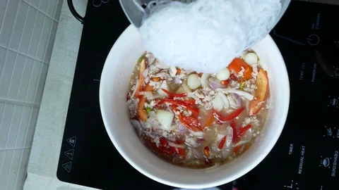 Put boiled bean vermicelli into white bowl Stock Footage 89954977