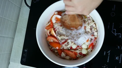 Put boiled bean vermicelli into white bowl Stock Footage 89955020