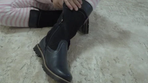Put on boots with a zipper Stock Footage 277719678