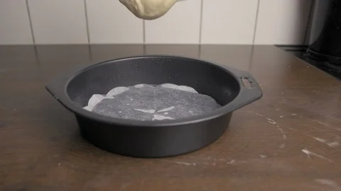 Put cake dough in a baking form. Stock Footage 94035600
