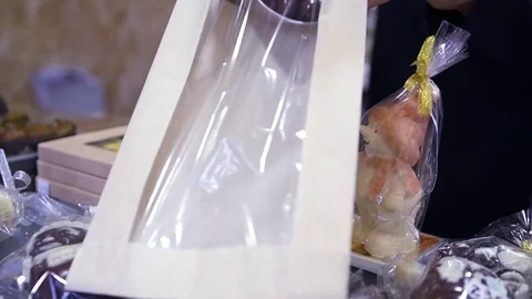 Put candy in a transparent package. HD, 1920x1080, slow motion Stock Footage 85123164