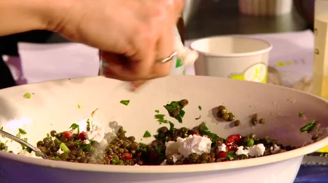 Put cheese in a salad of lentils Stock Footage 55163697