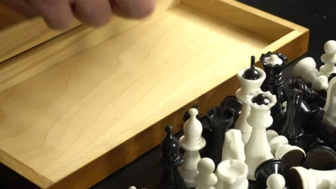 Put chess pieces in a box Stock Footage 142927710
