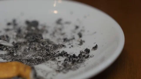 Put cigarette in the ashtray macro 4k Stock Footage 70595069