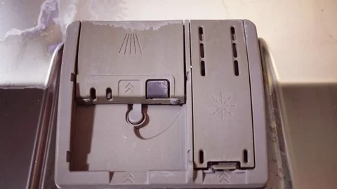 Put the cleaning tablet in the dishwasher Stock Footage 84142124