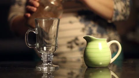 Put cocoa powder in a glass footed mug Stock Footage 159558024