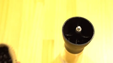 Put coffee beans into the hand grinder machine Stock Footage 108984365