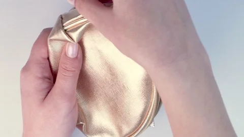 Put condom in a purse Stock Footage 173620506