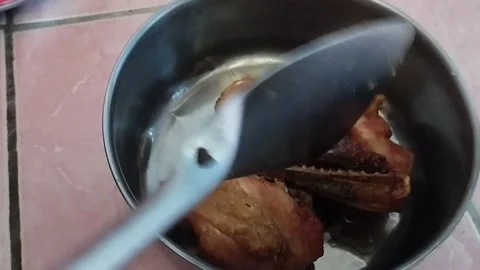 Put the cooked chicken Stock Footage 212499637