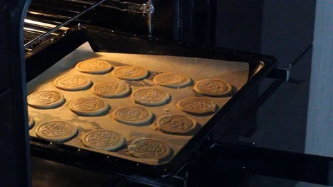 Put a cookie sheet in the oven. Stock Footage 129177748