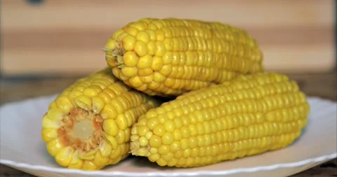 Put the corn on a plate - Close up Stock Footage 160717613