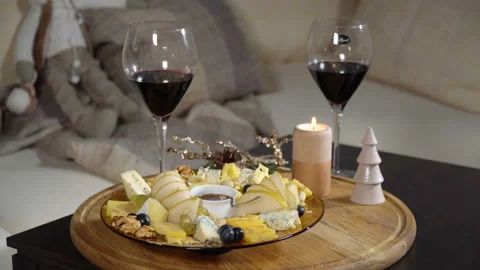 Put a dish with cheese and fruit on the table 動画素材 102531194