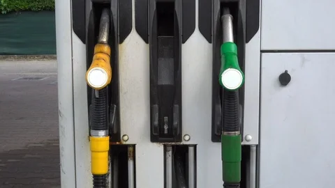 Put down the diesel fuel pump at the gas station Stock Footage 90053952