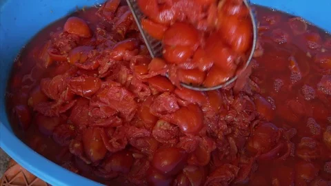 Put drip tomatoes cocked in a tub for sauce preparation Stock Footage 78137483