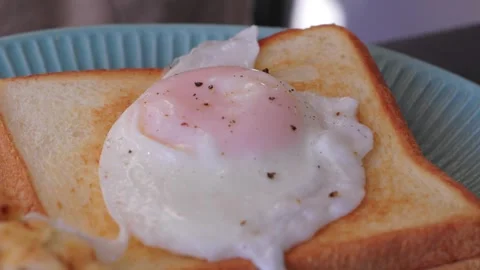 Put the eggs on the bread Stock Footage 320669821