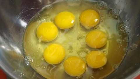 Put eggs inside the stainless balls Stock Footage 120318764