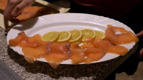 Put the fish in the dish - real life Stock Footage 83781858