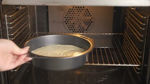 Put a flan case in the oven. Stock Footage 94036003