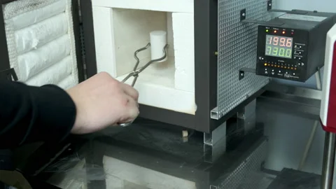 Put the flask in the oven. Stock Footage 183953216