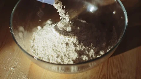 Put flour to the bowl in the kitchen Video stock 70942788