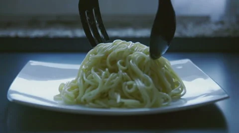 Put fresh spaghetti on a plate slow motion Stock Footage 57639092